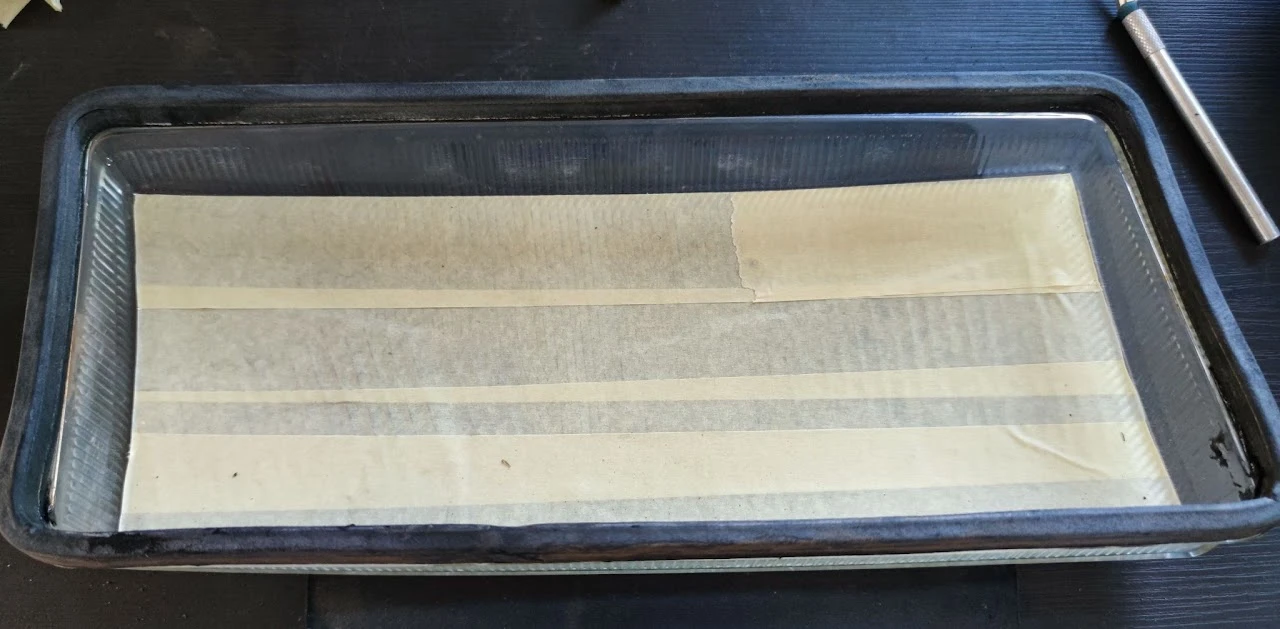 Masking the inner surface of the lens with tape