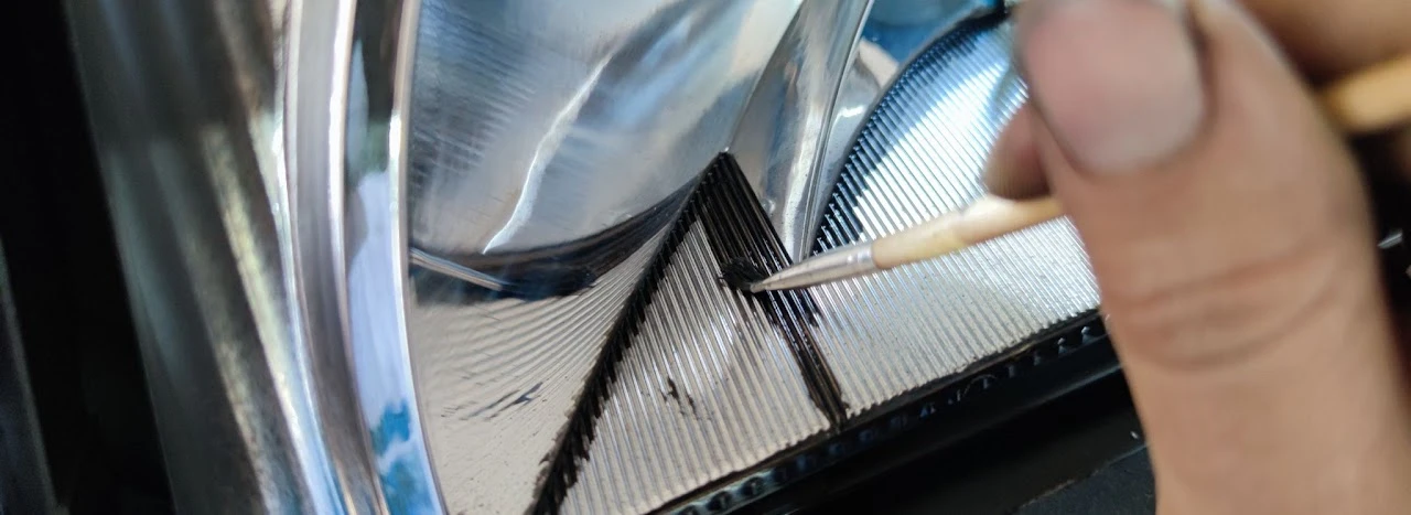 Brushing the edges along the bottom of the headlight